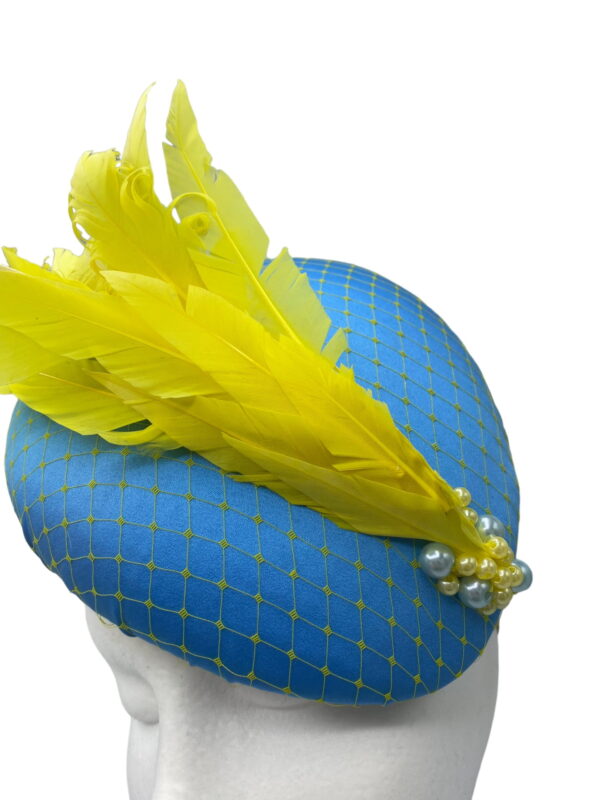 Blue large teardrop with yellow net overlay and yellow feather detail.